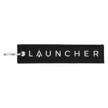 Load image into Gallery viewer, LAUNCHER REMOVE BEFORE FLIGHT KEY CHAIN BLACK

